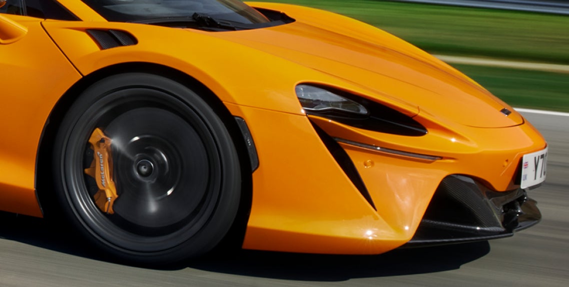 sunset parked Artura sportscar