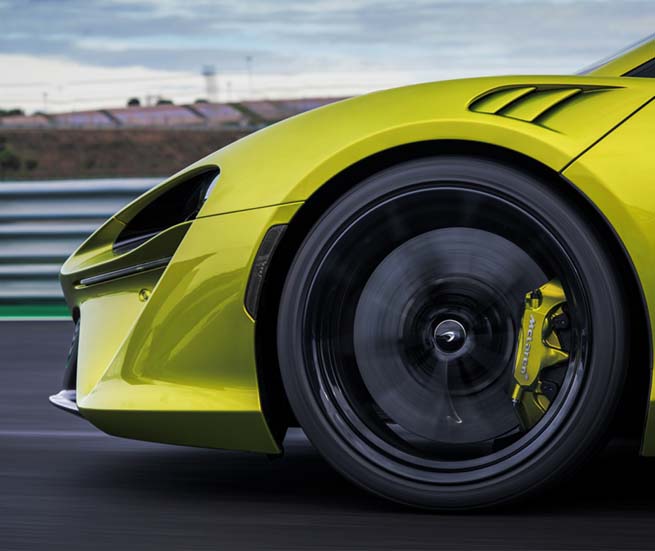 Artura front fender and headlights driving down track