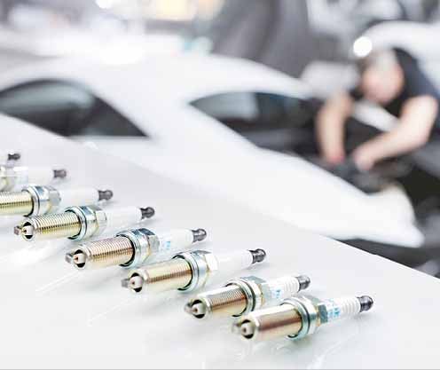 Spark plugs laying on work bench