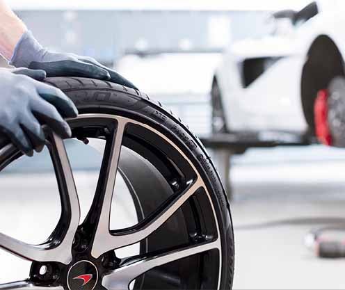 Tire being personally moved in service garage