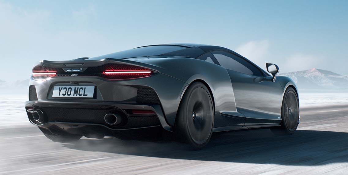 luxury sportscar with air intakes driving fast