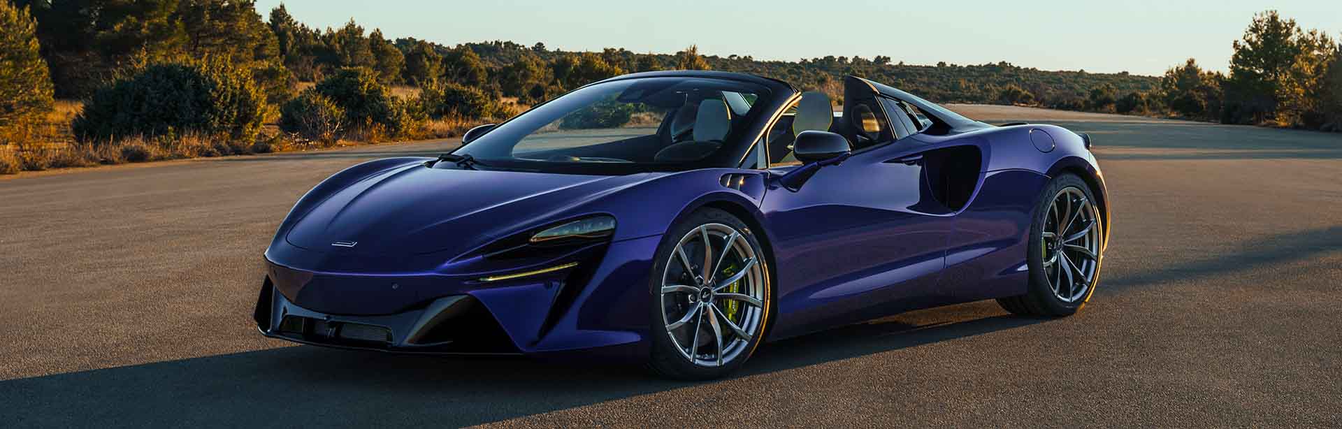 Parked Artura Spider outside