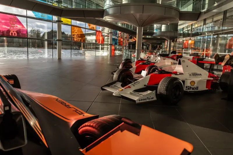 Red-and-white McLaren Formula 1 cars on display