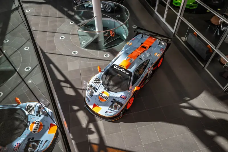 Overhead view of McLaren F1 GTR race cars in Gulf livery at the McLaren Technology Centre