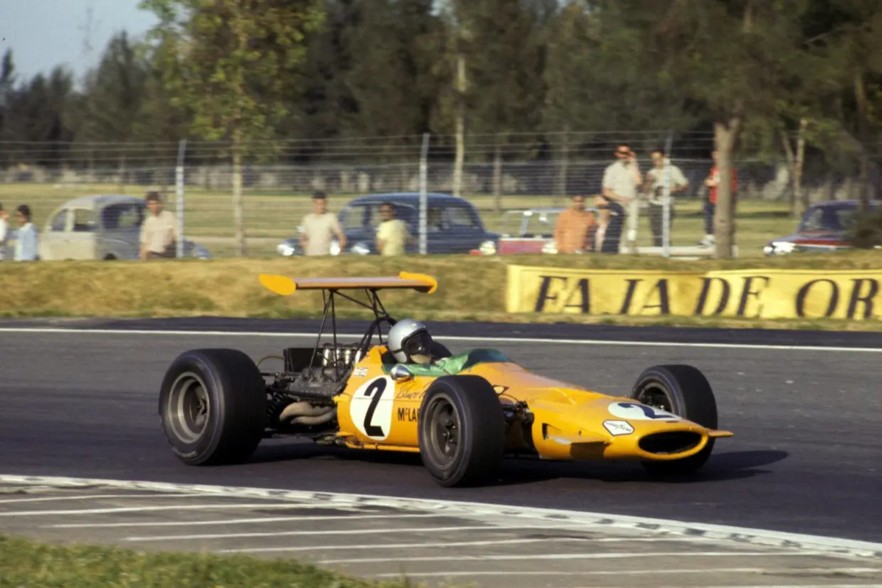 Bruce McLaren racing his papaya McLaren M7A Formula 1 car
