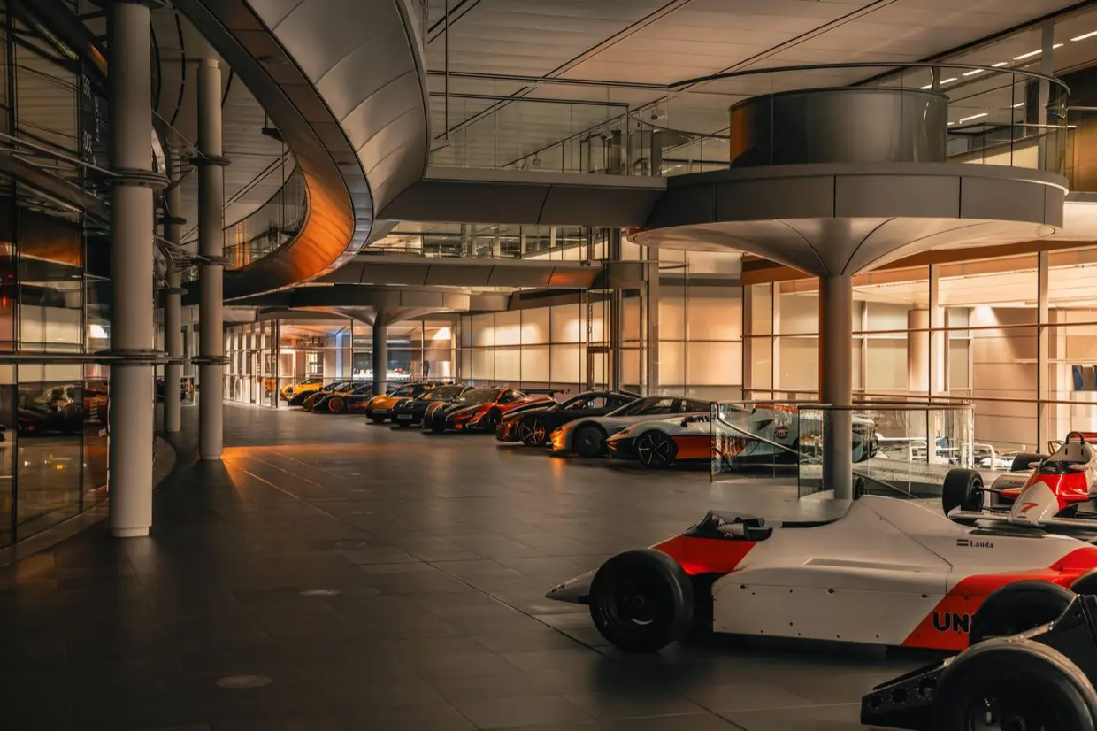 The McLaren Technology Centre boulevard lined with historic McLaren race cars